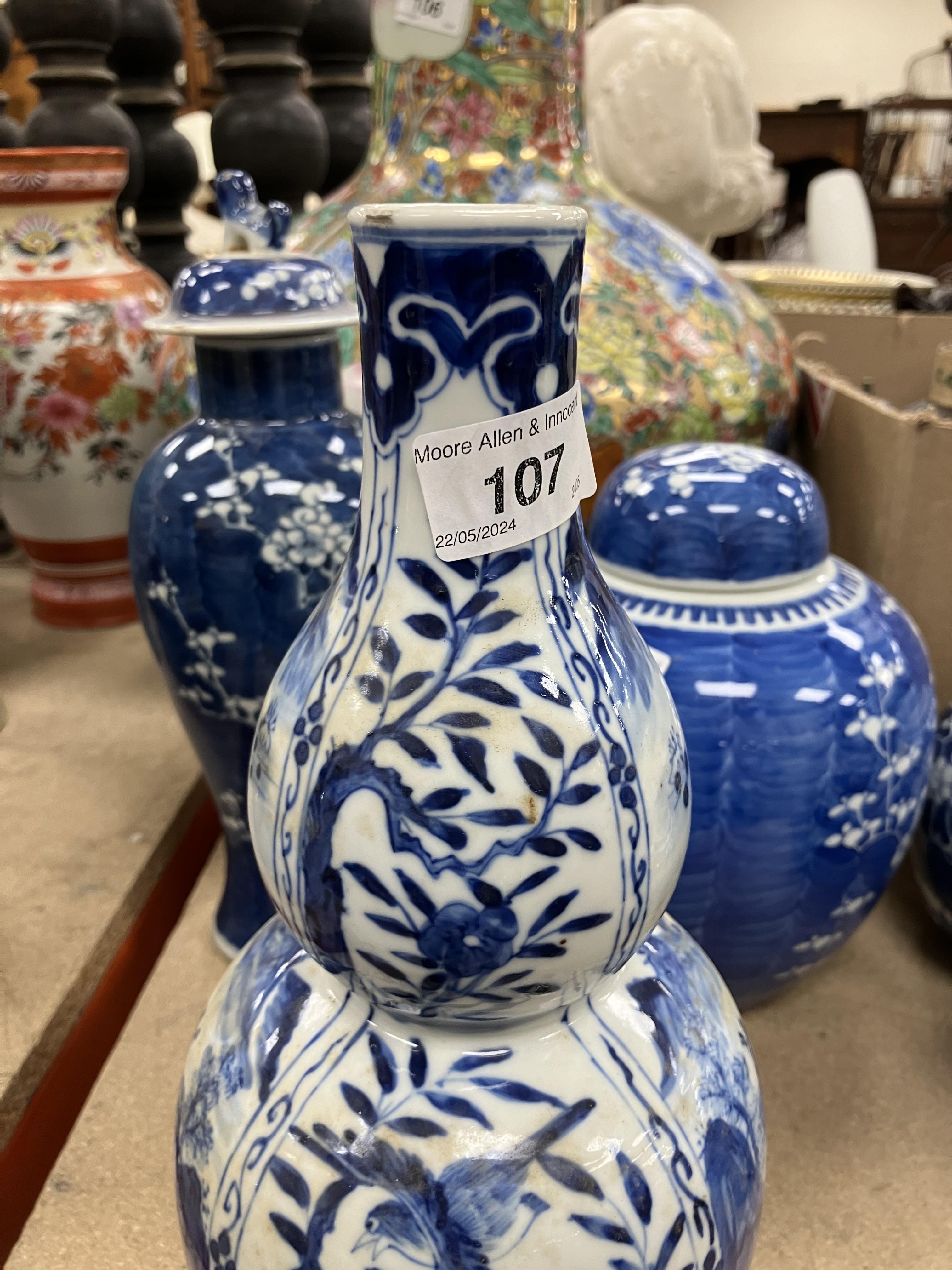 A Chinese blue and white double gourd shaped vase decorated with panels of figures in watery - Image 16 of 26