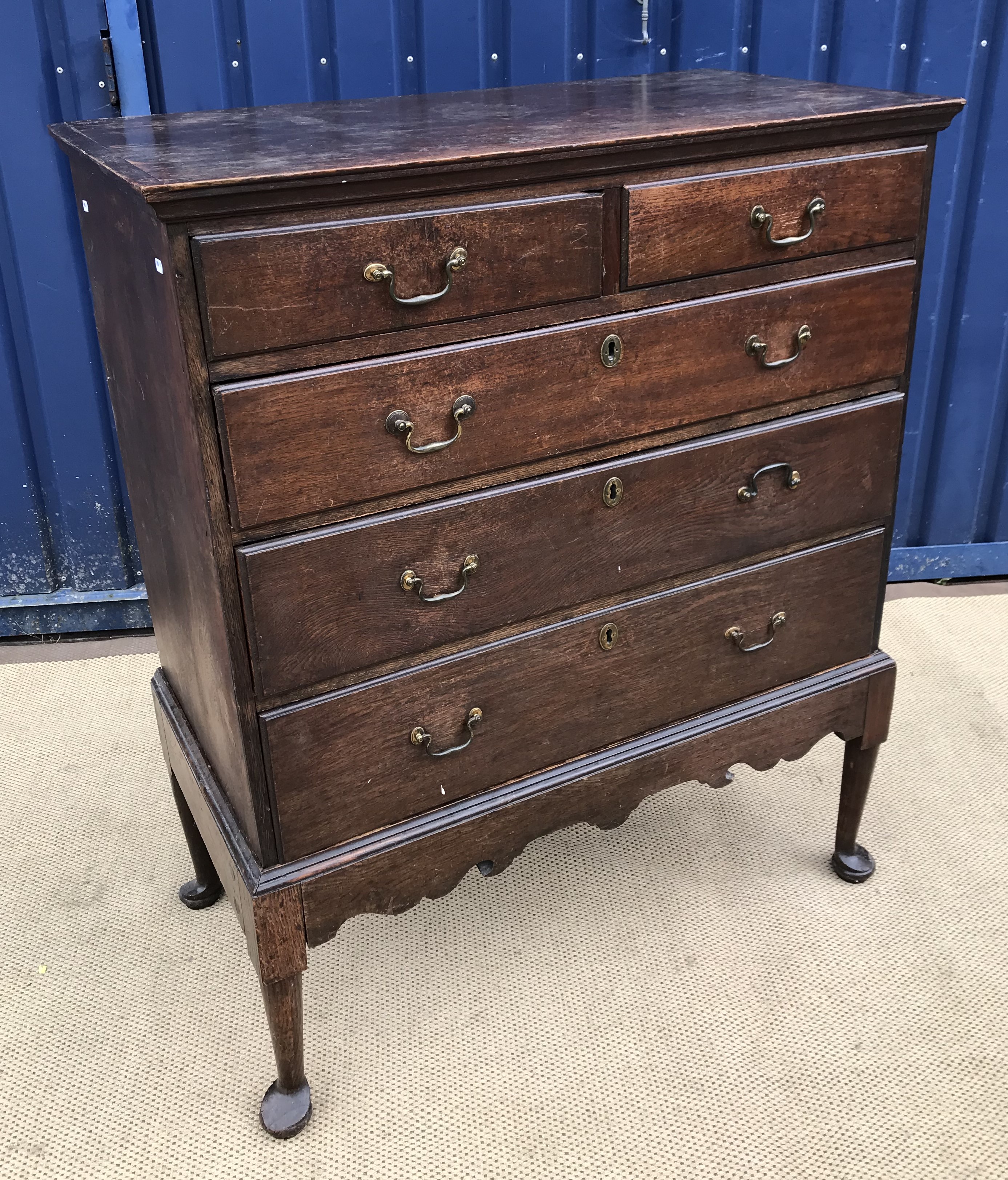 A late George III oak chest on stand,