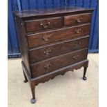 A late George III oak chest on stand,