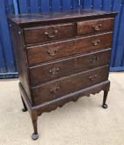 A late George III oak chest on stand,