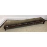 A Victorian mahogany kneeler stool with drop-in upholstered seat within a scrolling foliate