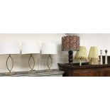 A set of three contemporary gold painted metal navette design table lamps and shades approx.