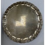 An Edwardian silver salver in the Georgian style with pie crust rim,