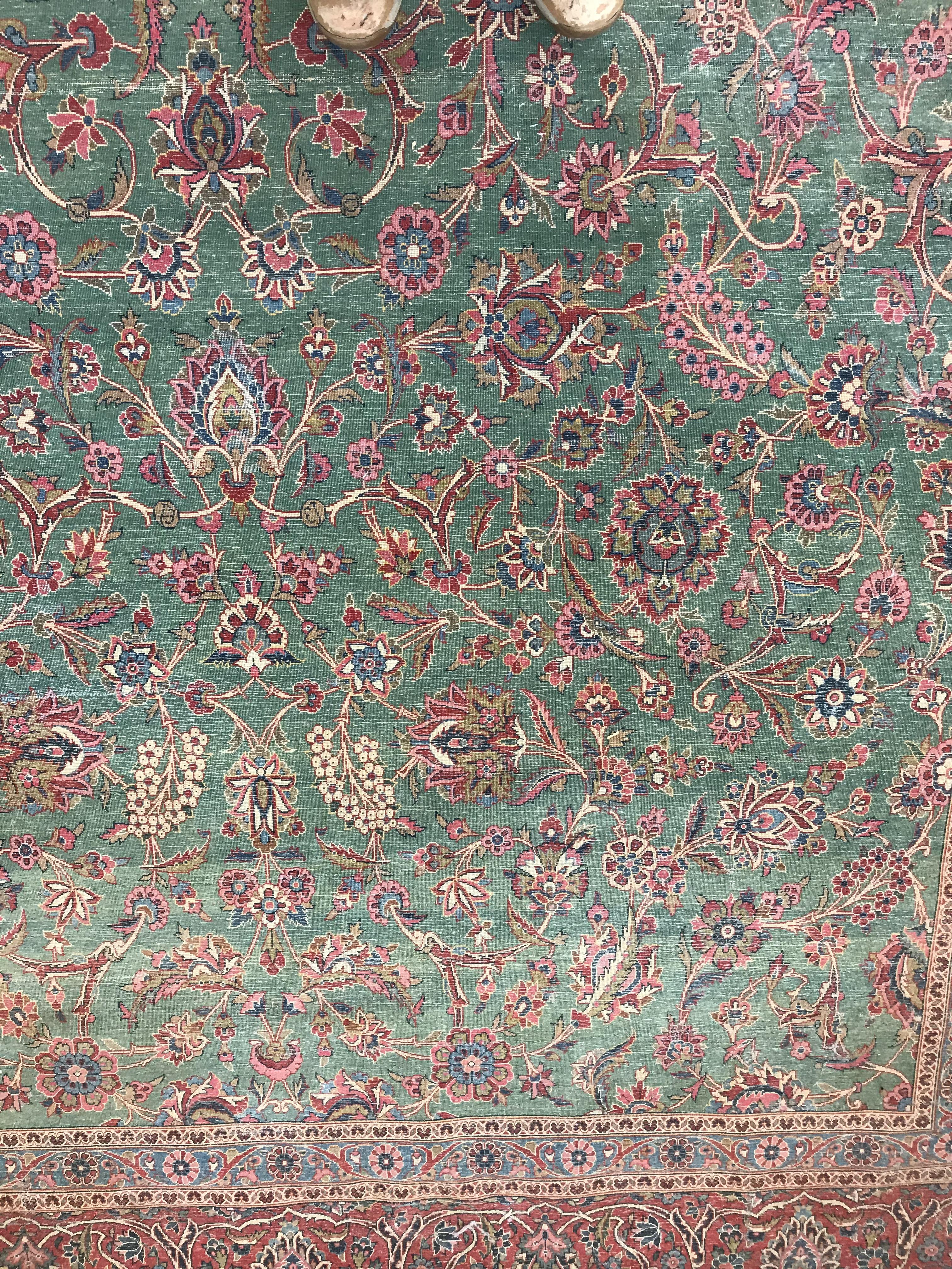 A Persian carpet, the central panel set with all-over scrolling foliate design on a teal ground, - Image 28 of 41