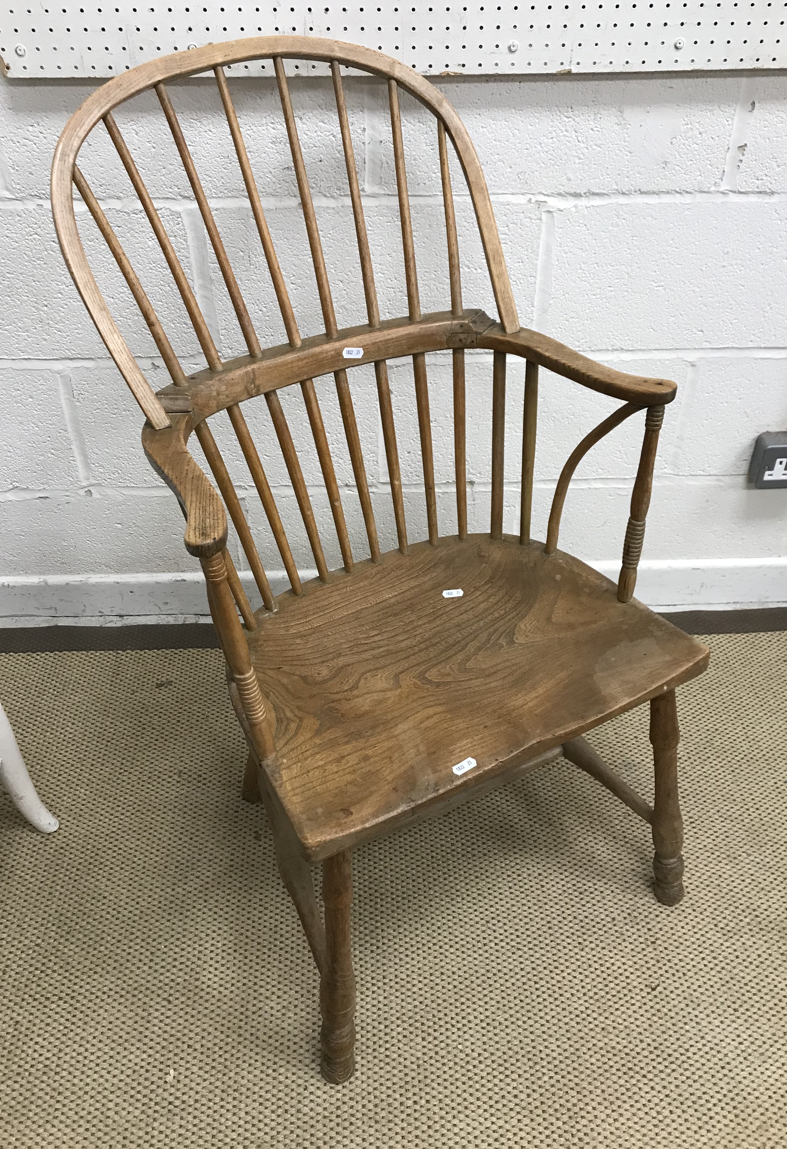 An early 19th Century West Country ash and elm stick back elbow chair,