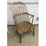 An early 19th Century West Country ash and elm stick back elbow chair,