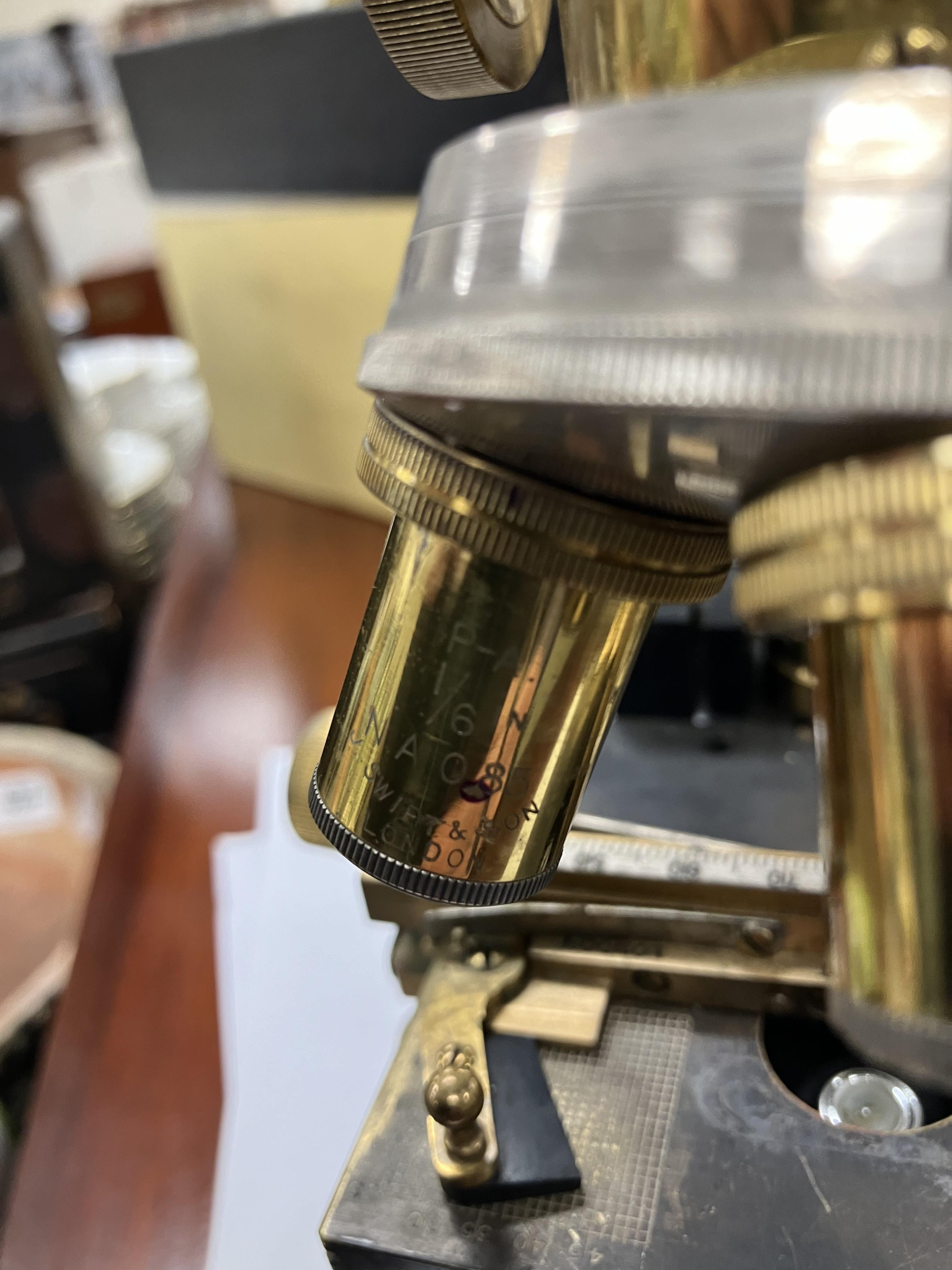 An early 20th Century Swift & Son of London brass and anodised cased monocular microscope and - Image 48 of 61