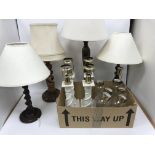 A box containing two pairs of barley-twist type table lamps,