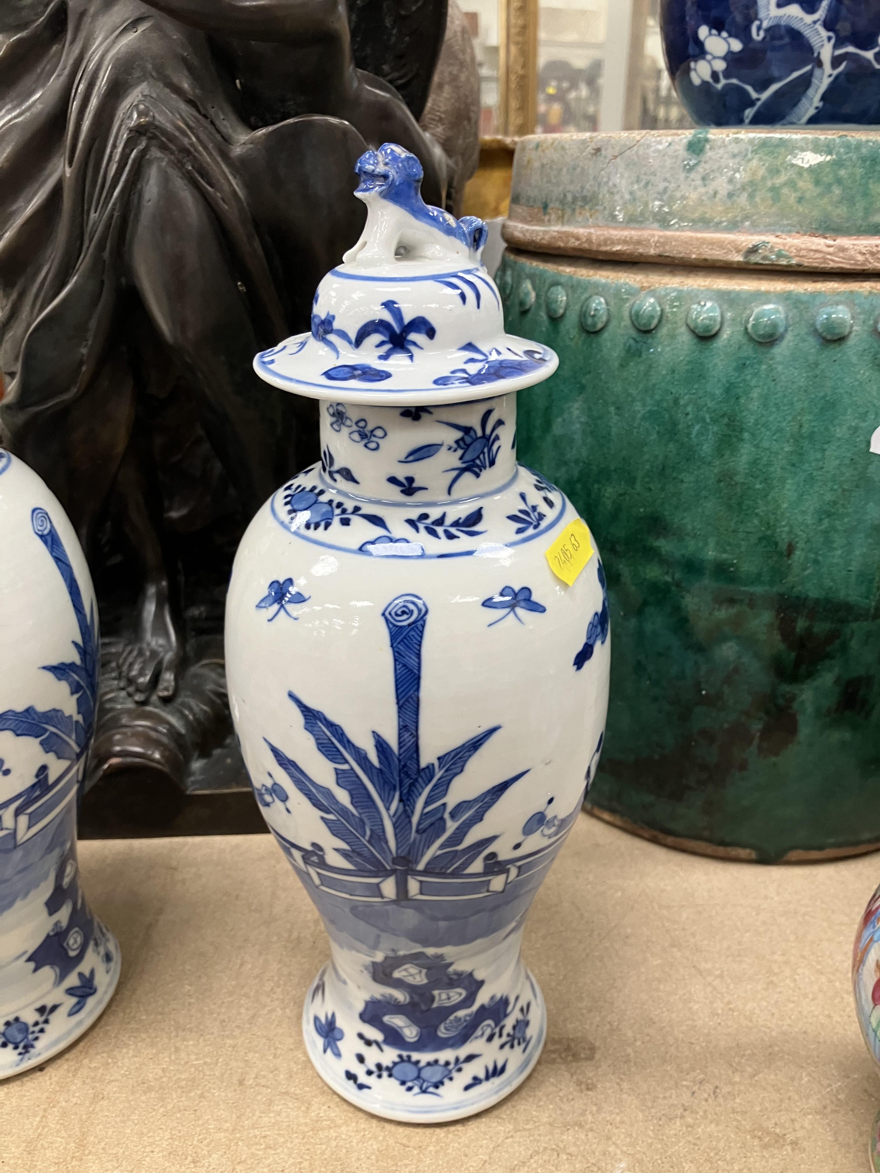 A pair of 19th Century Chinese blue and white baluster shaped vases and covers, - Image 24 of 54