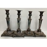 A set of four 19th Century plated on copper table candlesticks with gadrooned banded decoration