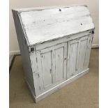 A 19th Century Continental pine bureau with later painted finish,