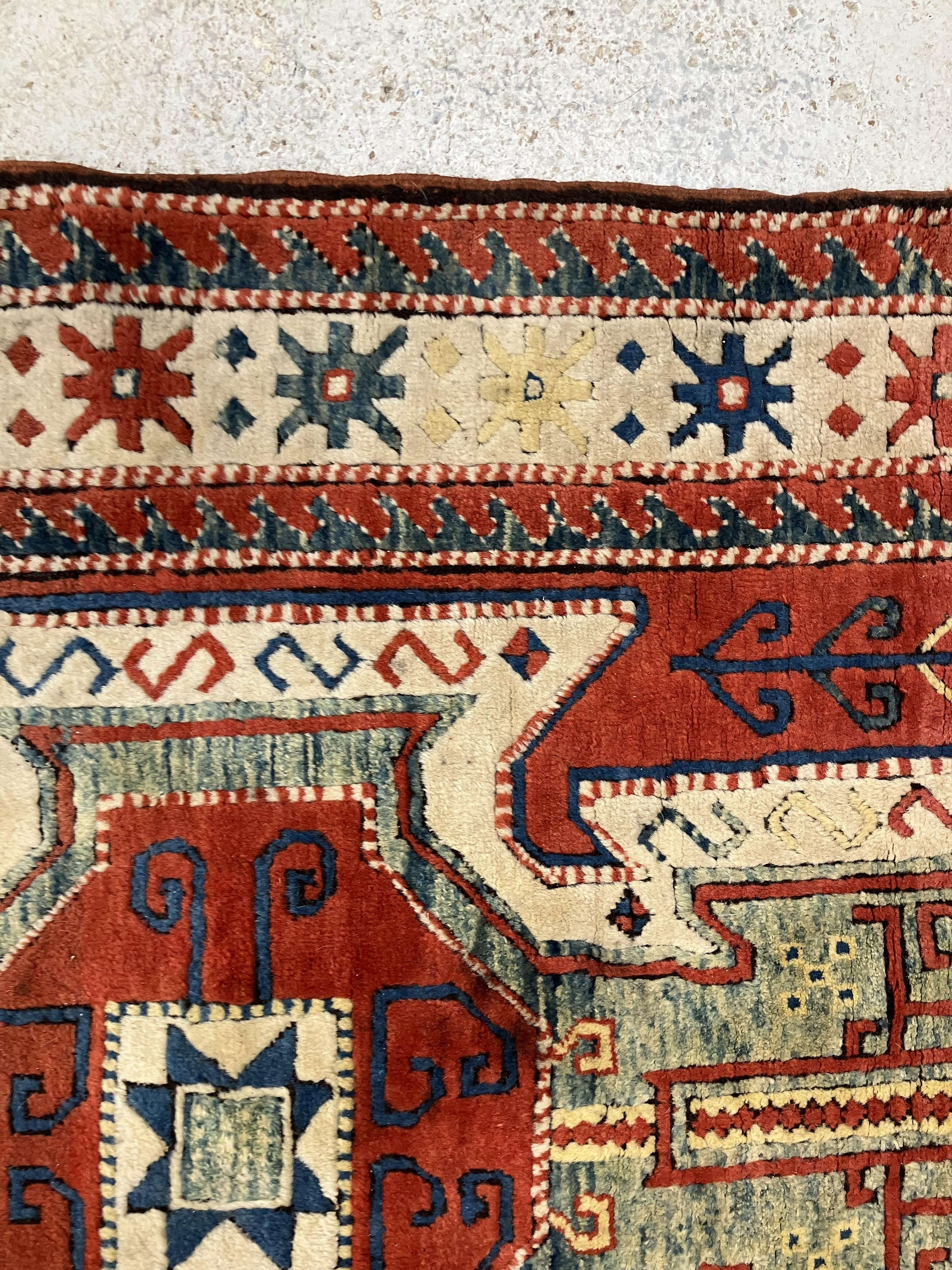 A fine Turkish carpet, - Image 6 of 16