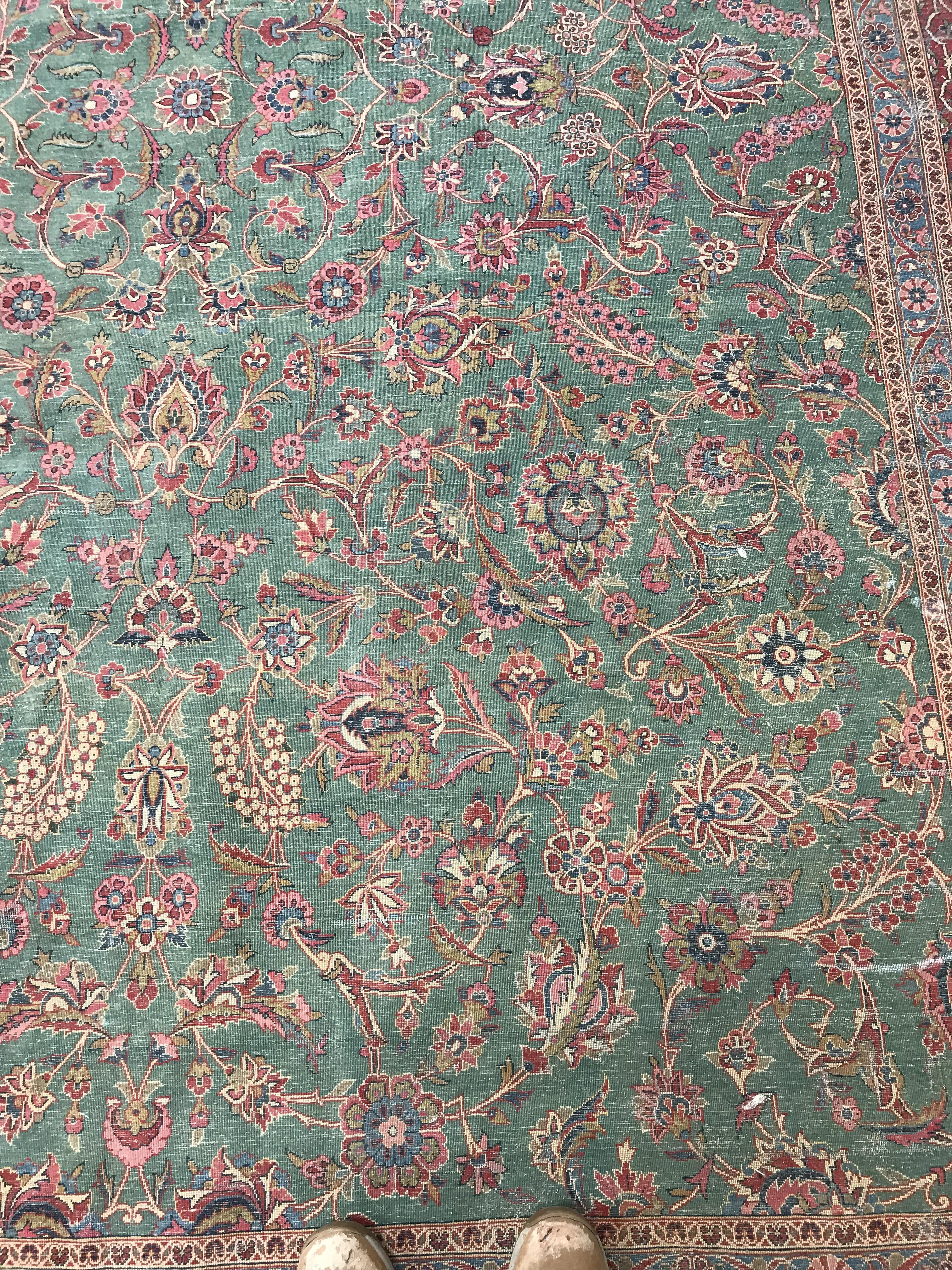 A Persian carpet, the central panel set with all-over scrolling foliate design on a teal ground, - Image 35 of 41