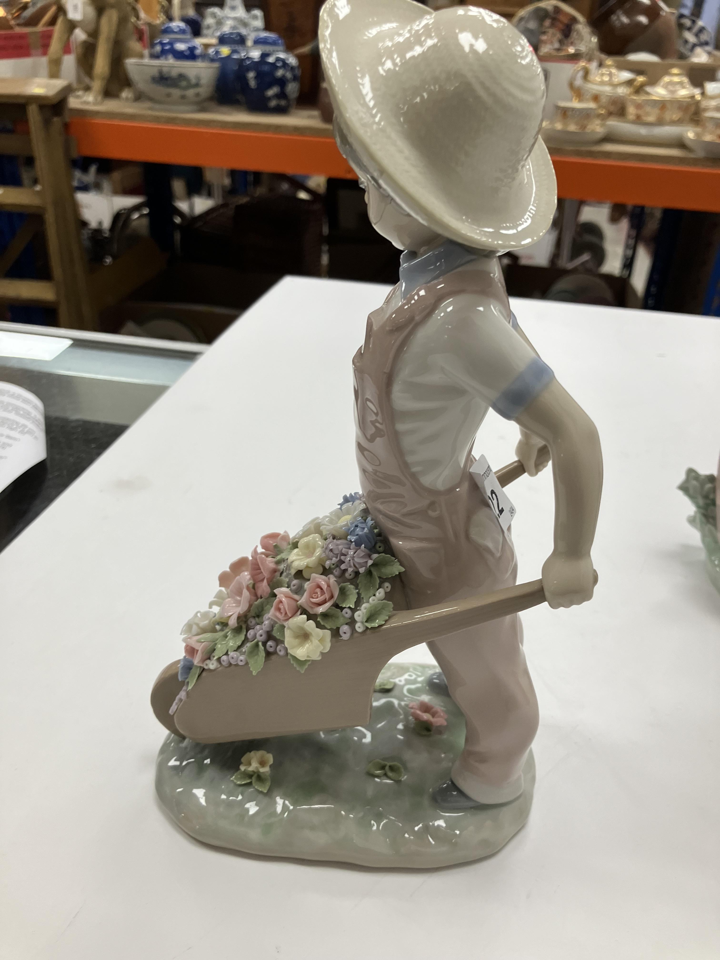 A collection of Lladro figures comprising "Little Gardener" figure of a young boy with wheelbarrow - Image 20 of 23