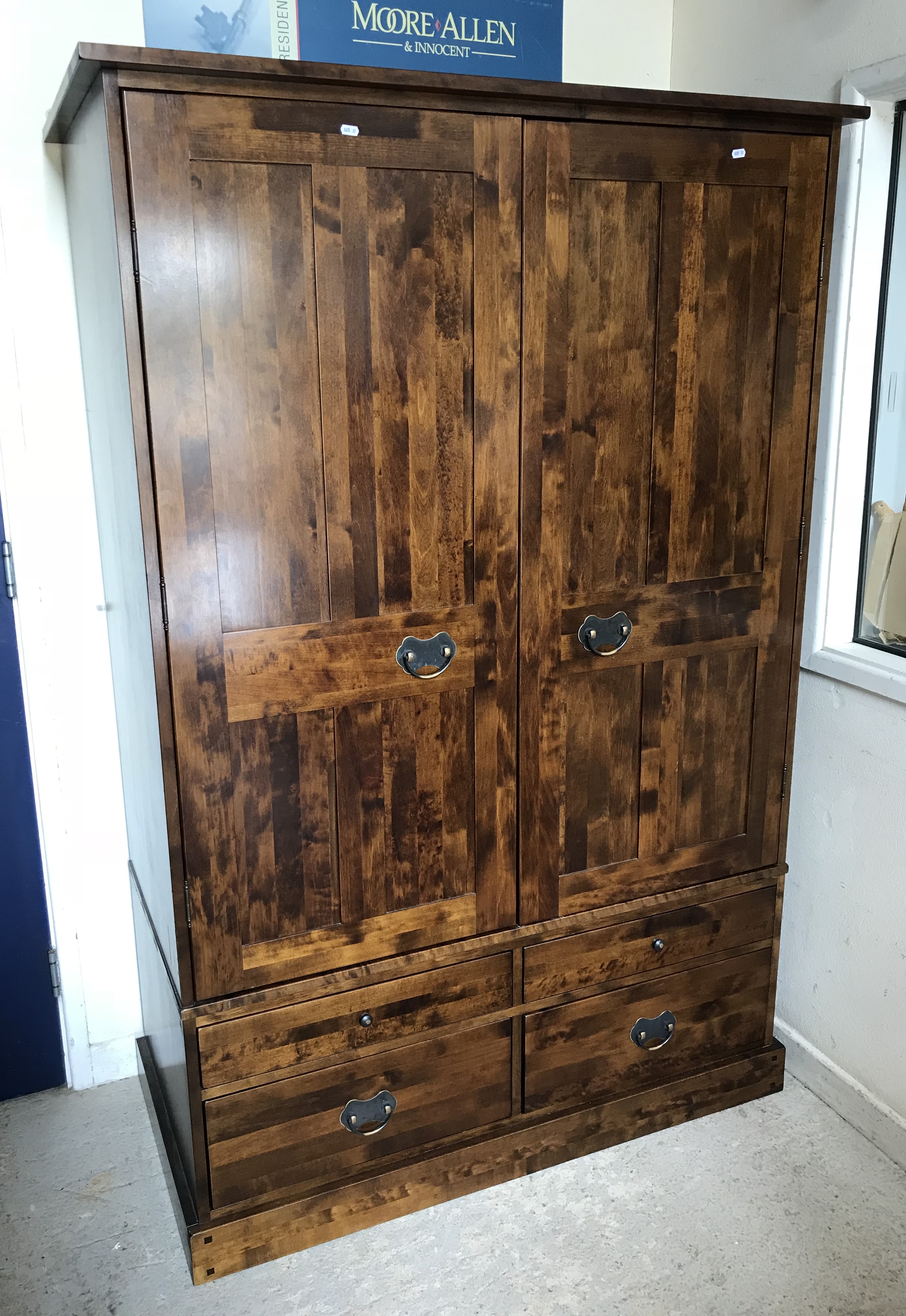 A Laura Ashley "Garrat" dark chestnut two door wardrobe with bank of four drawers below in the