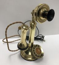 A vintage GEC brass candlestick telephone 30 cm high