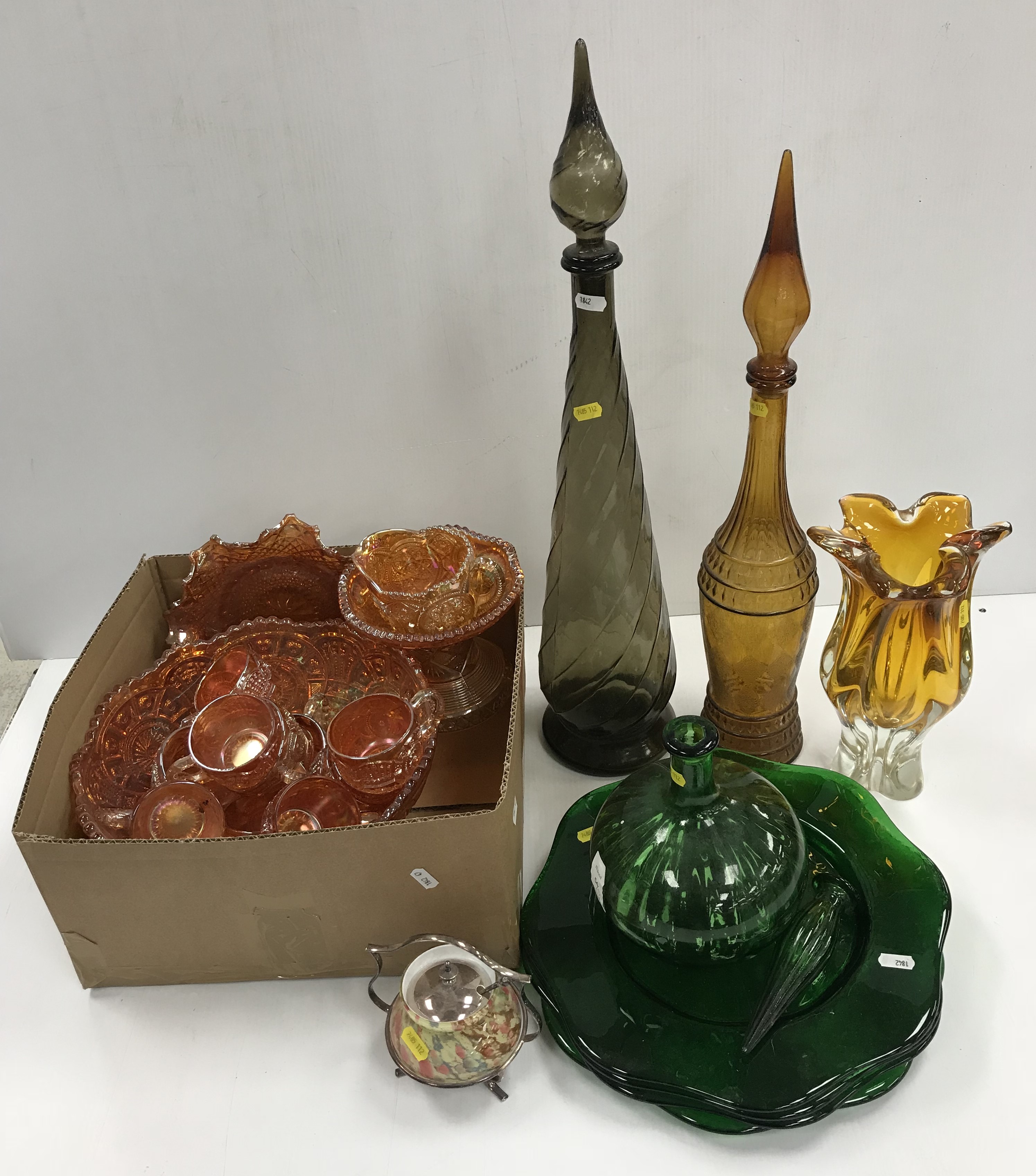 A collection of coloured glassware to include tangerine carnival glassware,