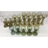 A set of three German green glass roemers, approx 13 cm high, together with another similar darker,