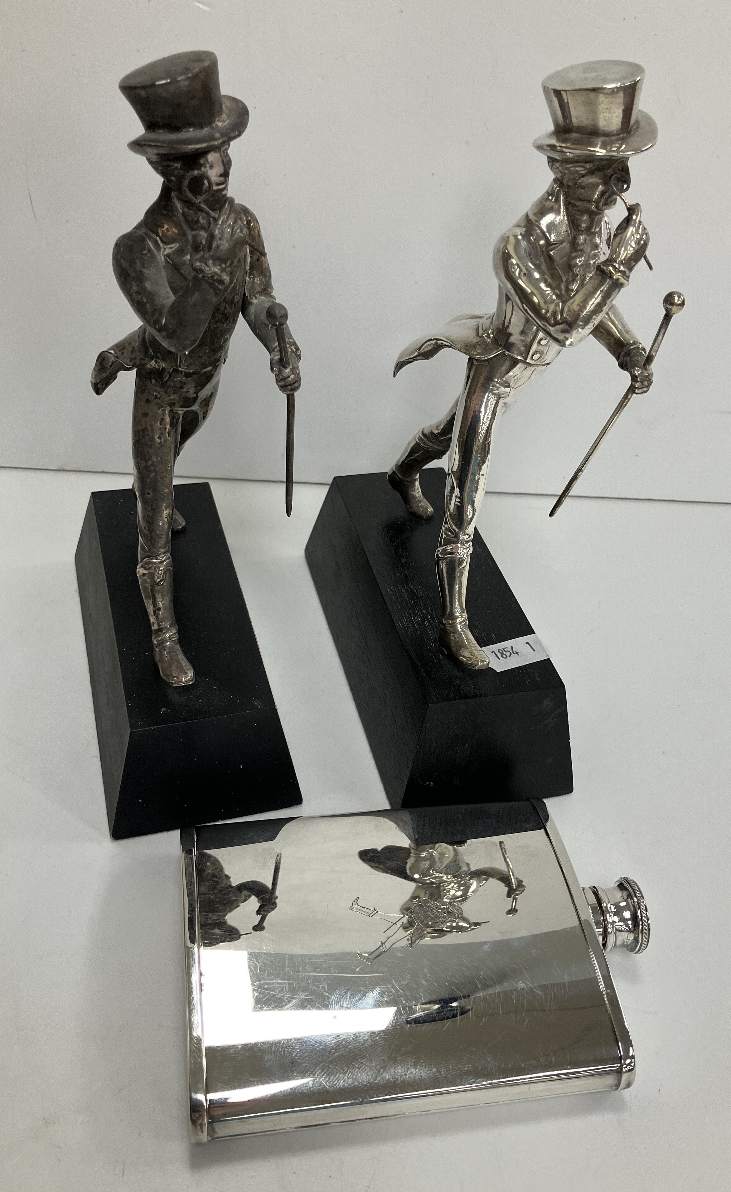 Two plated "Johnnie Walker" advertising figures on ebonised wooden bases, 22.