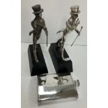 Two plated "Johnnie Walker" advertising figures on ebonised wooden bases, 22.