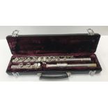 A plated three piece flute by Buffet of Paris,