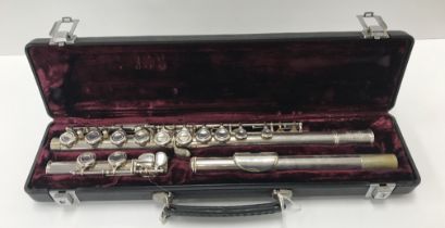 A plated three piece flute by Buffet of Paris,