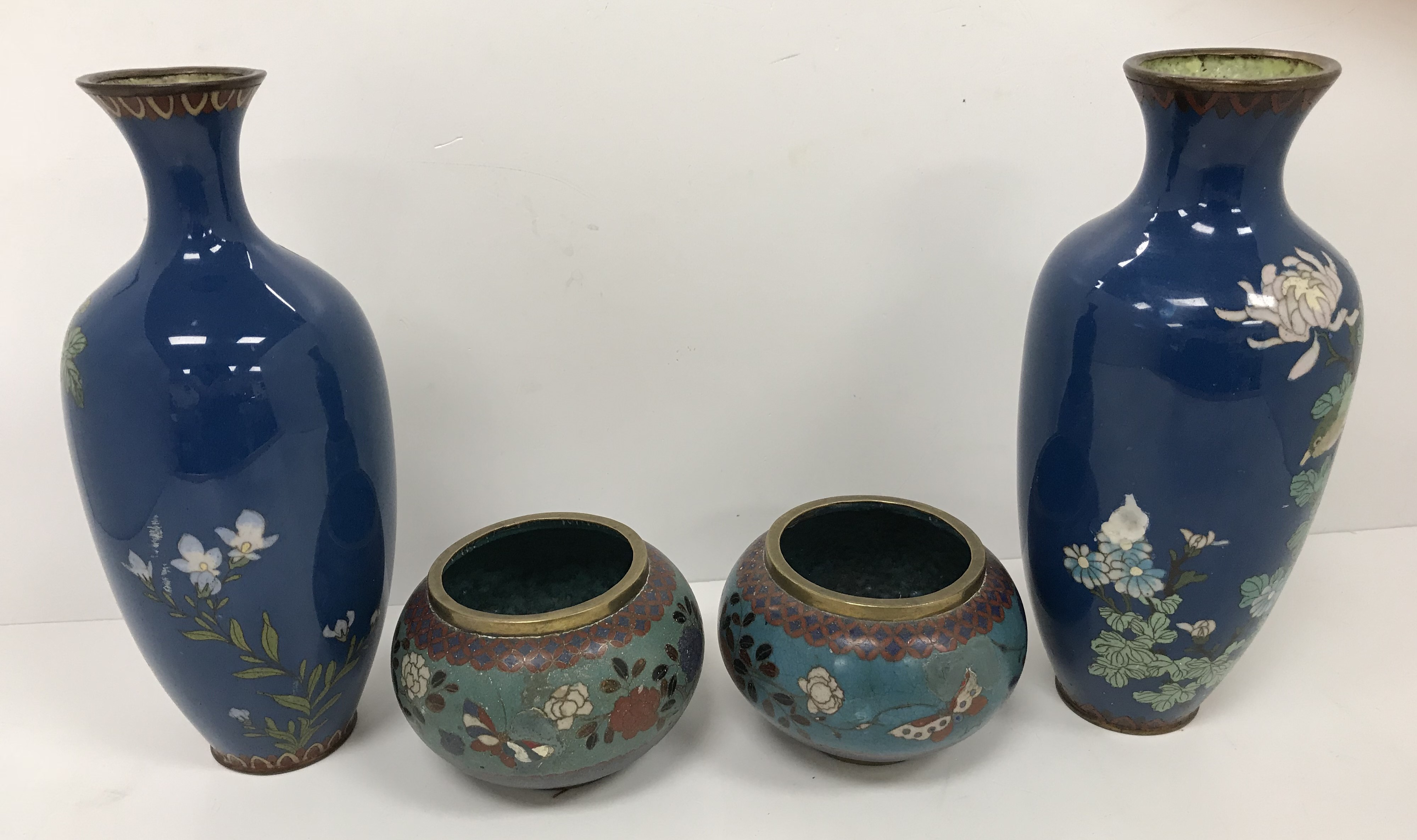 Two similar Chinese blue ground cloisonné vases with floral spray and blossom decoration,