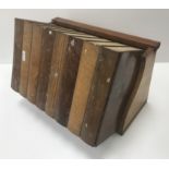 A circa 1900 sample wood box as a trough of eight books, 34.5 cm wide x 23.