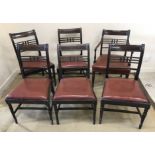 A set of five Victorian mahogany bar back dining chairs with drop in seats on turned legs united by