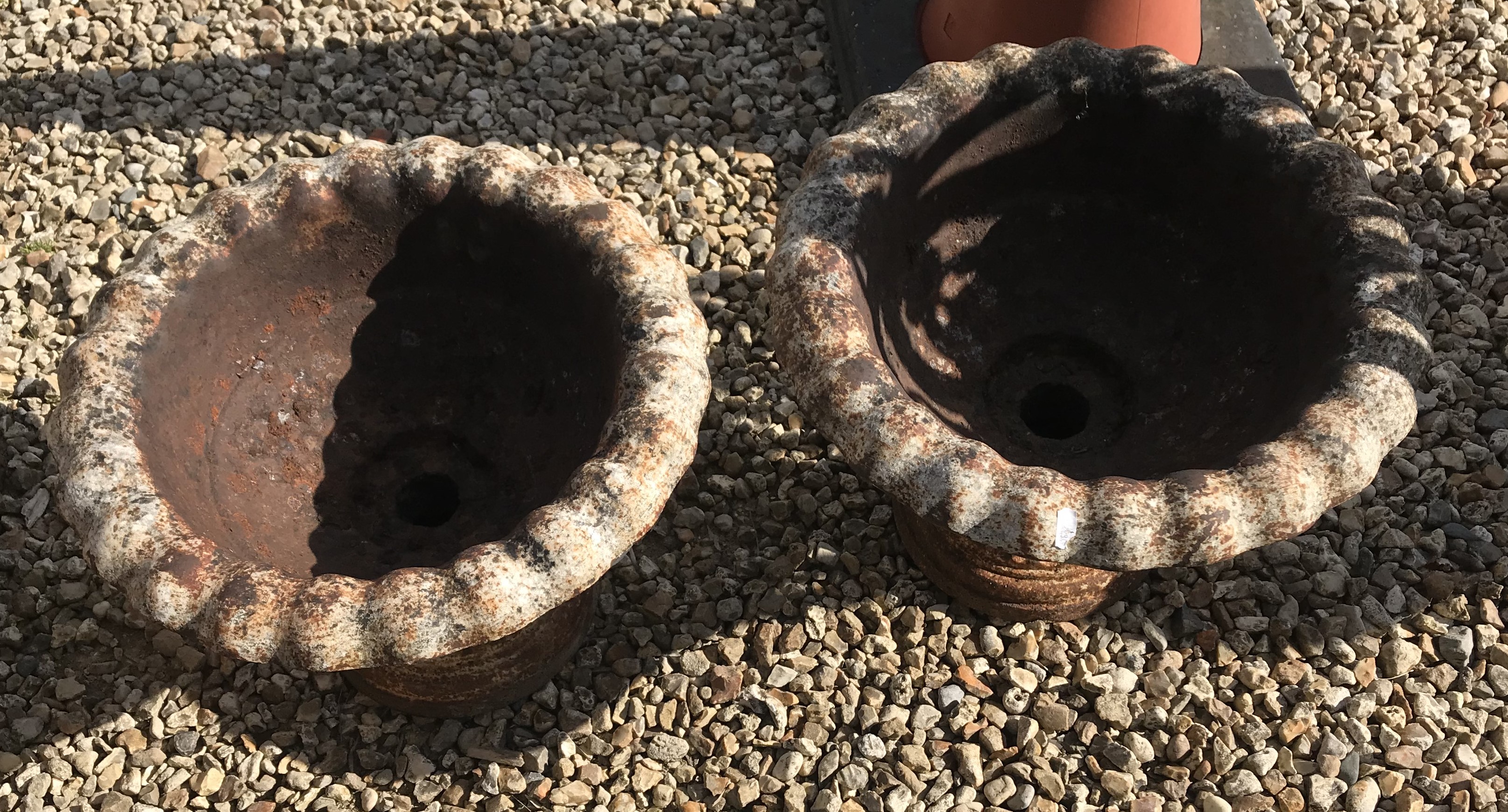 Two cast iron urns,