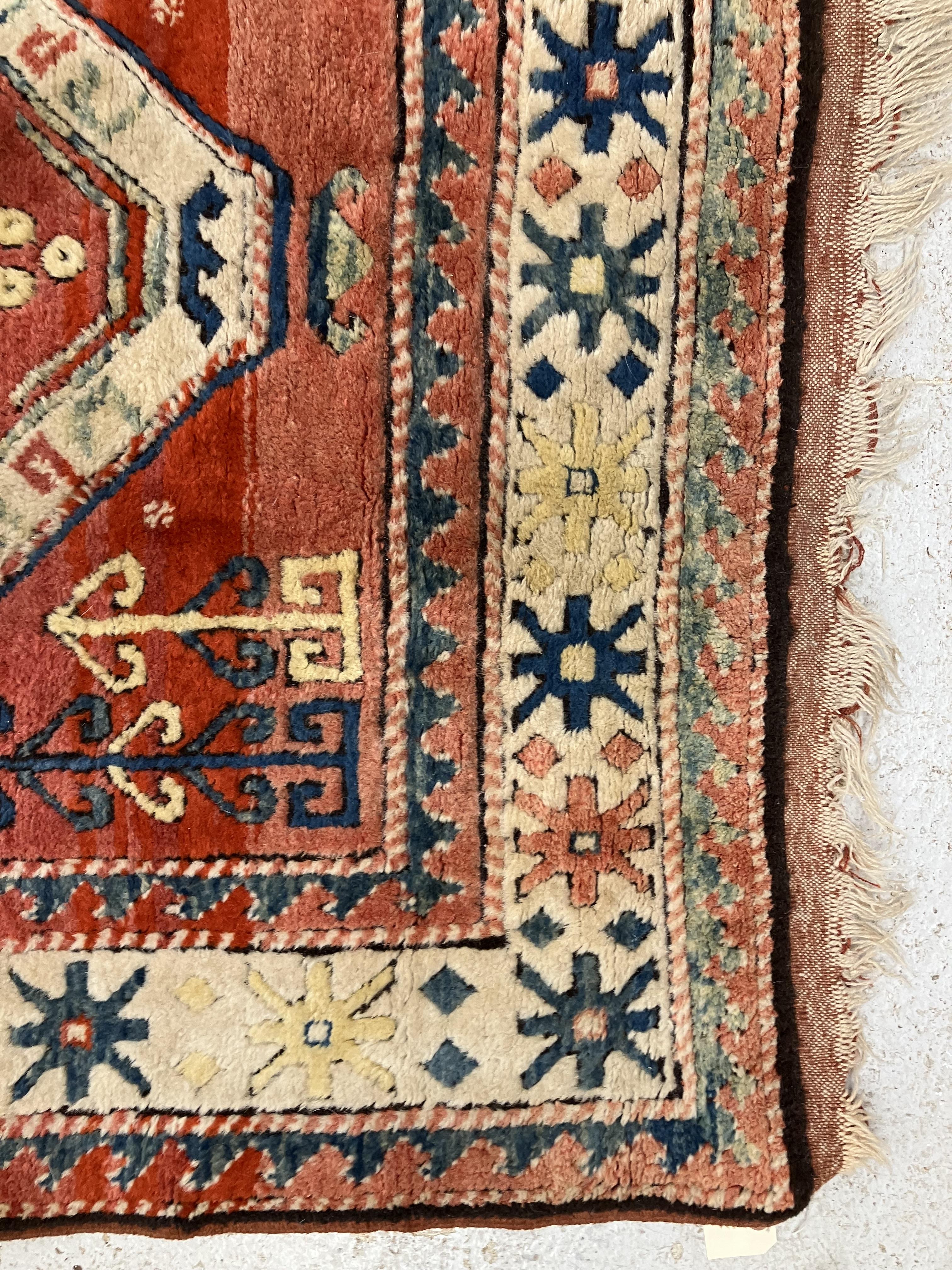 A fine Turkish carpet, - Image 3 of 16