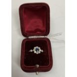 An early to mid 20th Century yellow metal mounted sapphire and diamond flower head dress ring,
