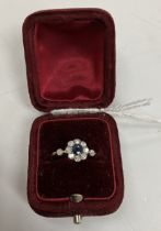 An early to mid 20th Century yellow metal mounted sapphire and diamond flower head dress ring,
