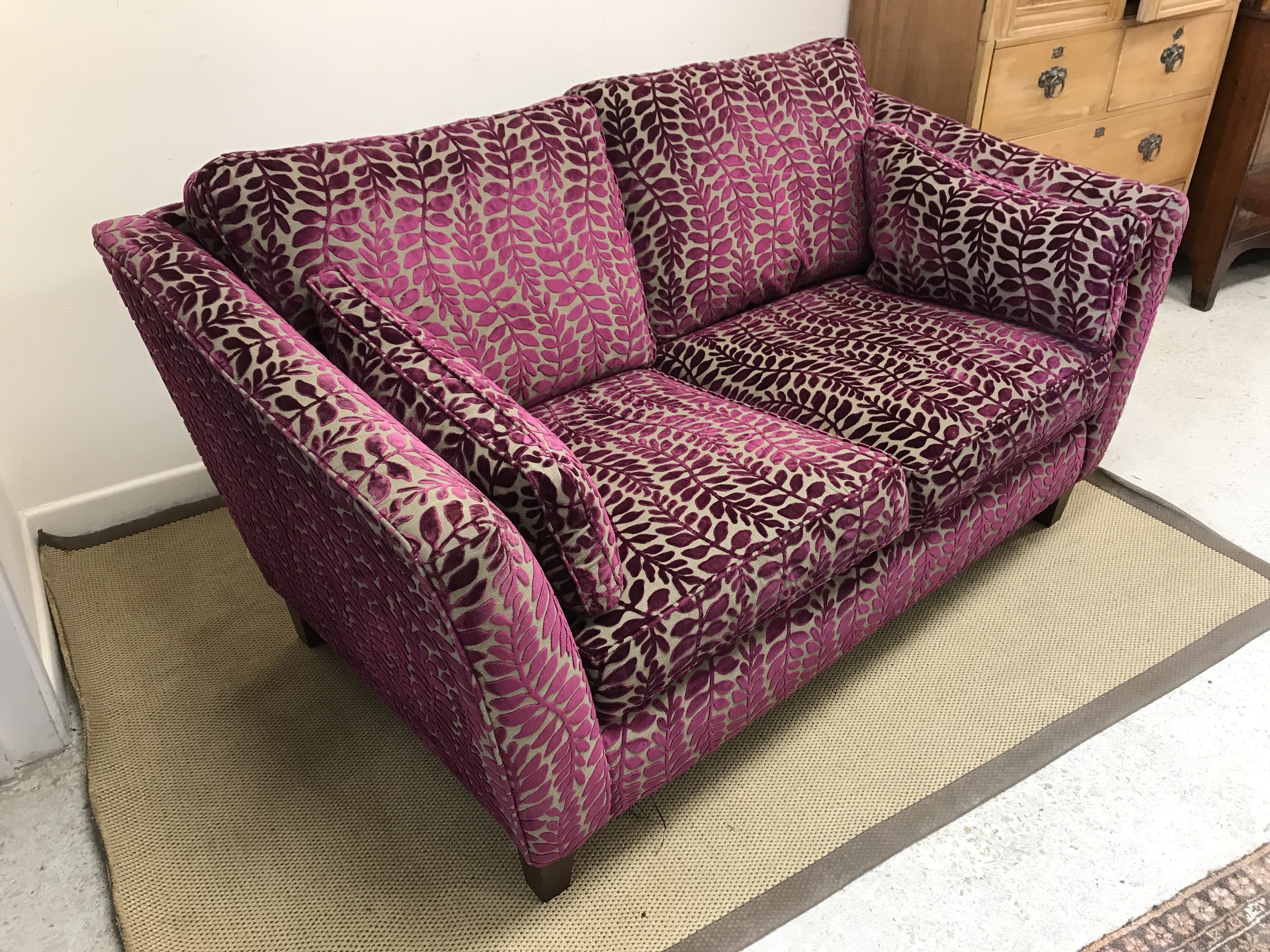 A modern two seat sofa with purple and mushroom foliate decorated upholstery raised on square - Image 2 of 2