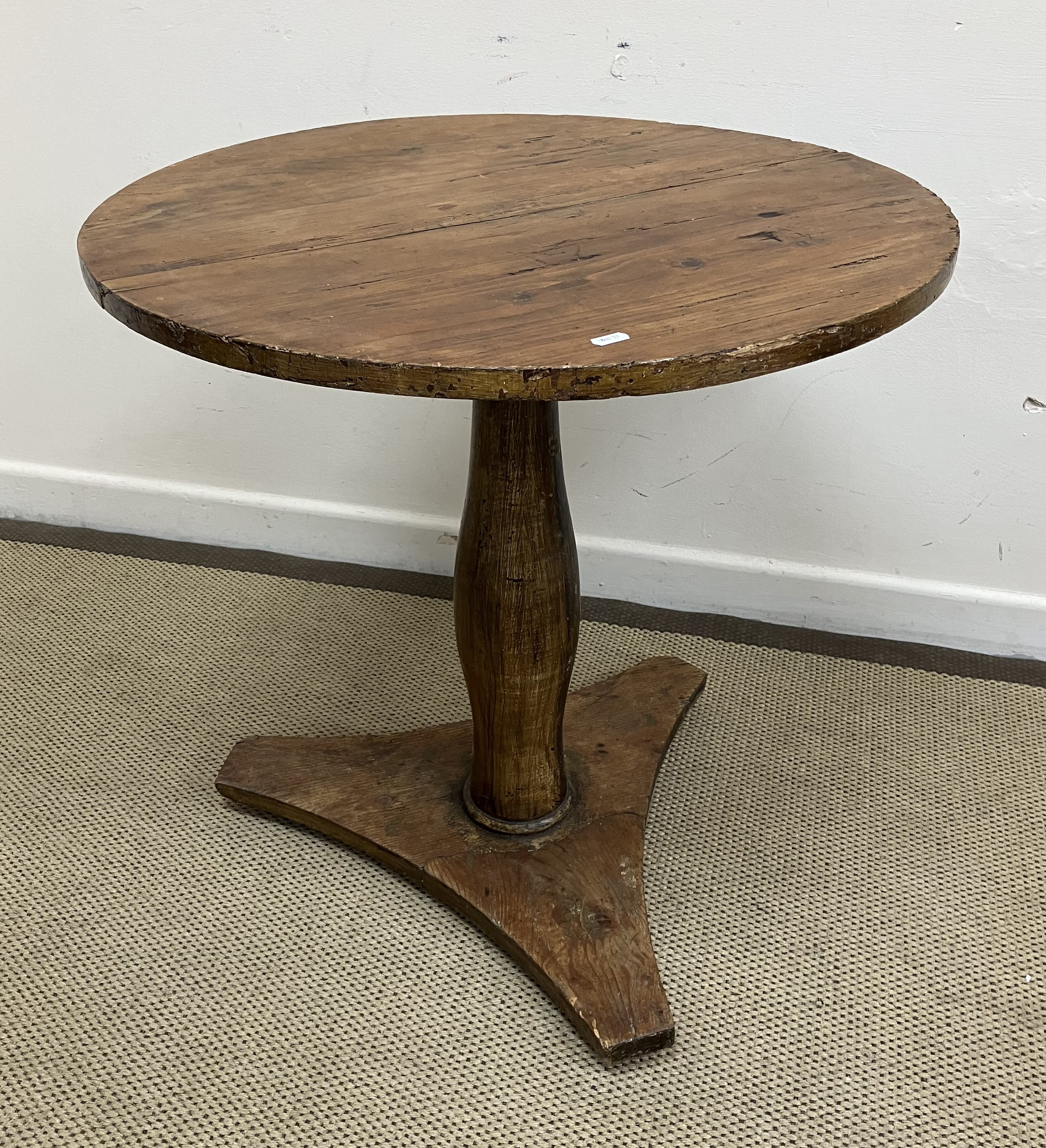 A Victorian walnut gypsy table, the circular pine top on a typical carved walnut tripod base,