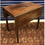 An early 19th Century mahogany rectangular drop leaf Pembroke table on square tapered legs with