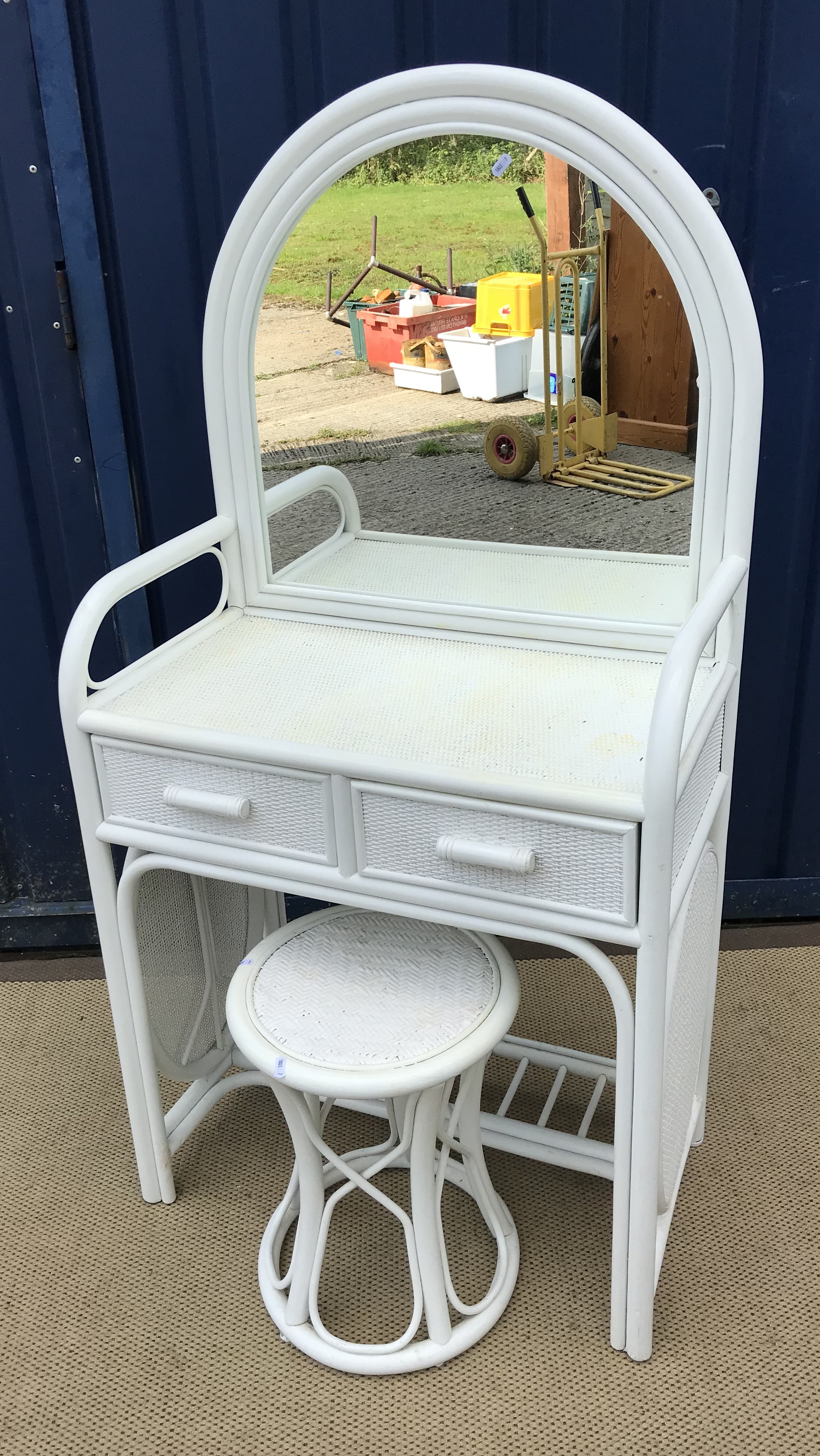 A modern white painted faux bamboo and caned dome topped mirrored dressing table with two drawers