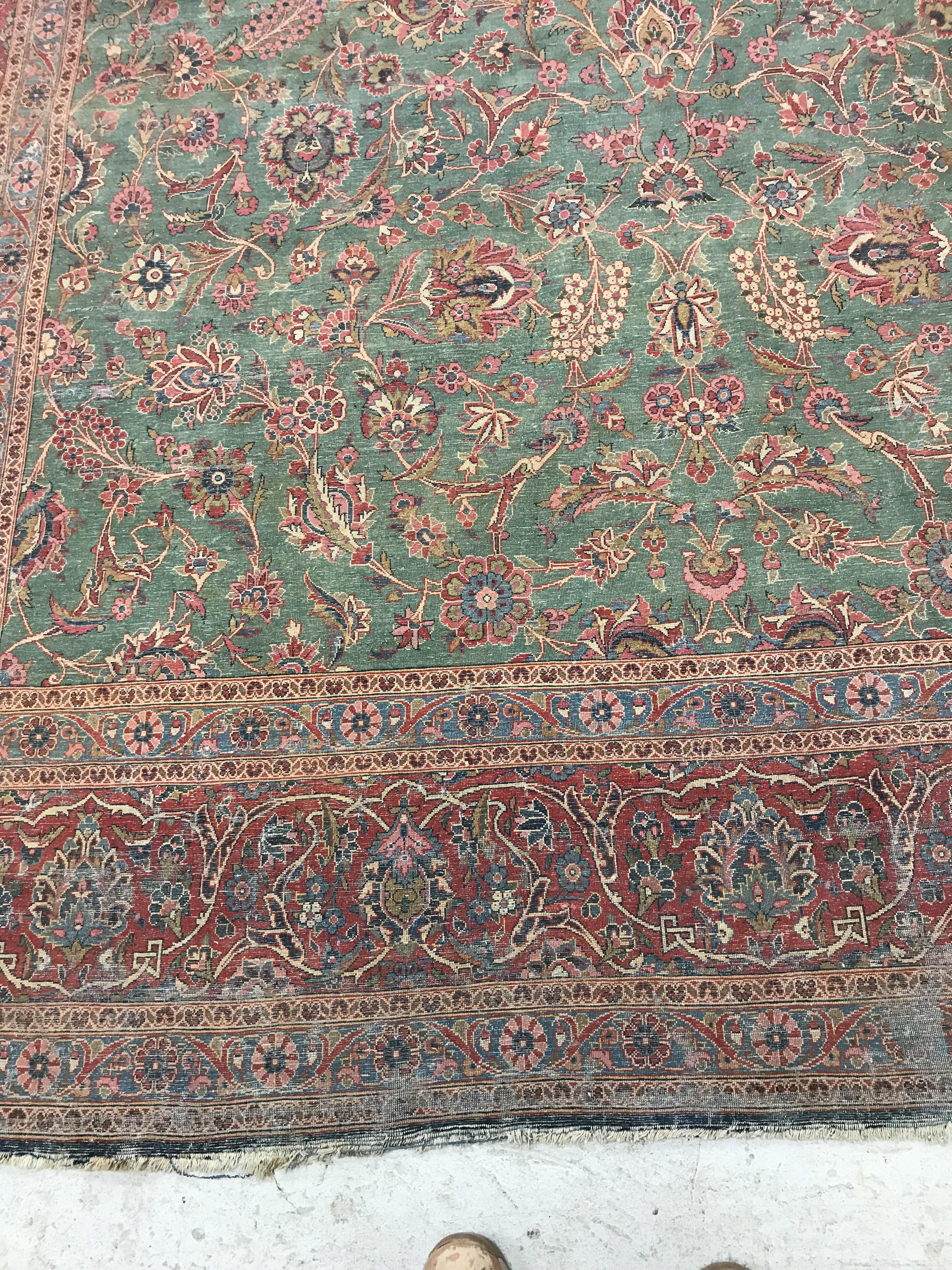 A Persian carpet, the central panel set with all-over scrolling foliate design on a teal ground, - Image 39 of 41