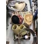 Two boxes of assorted textiles to include eiderdown type throws, bowler hat,