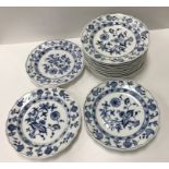 A collection of twelve Meissen "Blue Onion" pattern plates bearing blue crossed swords marks to