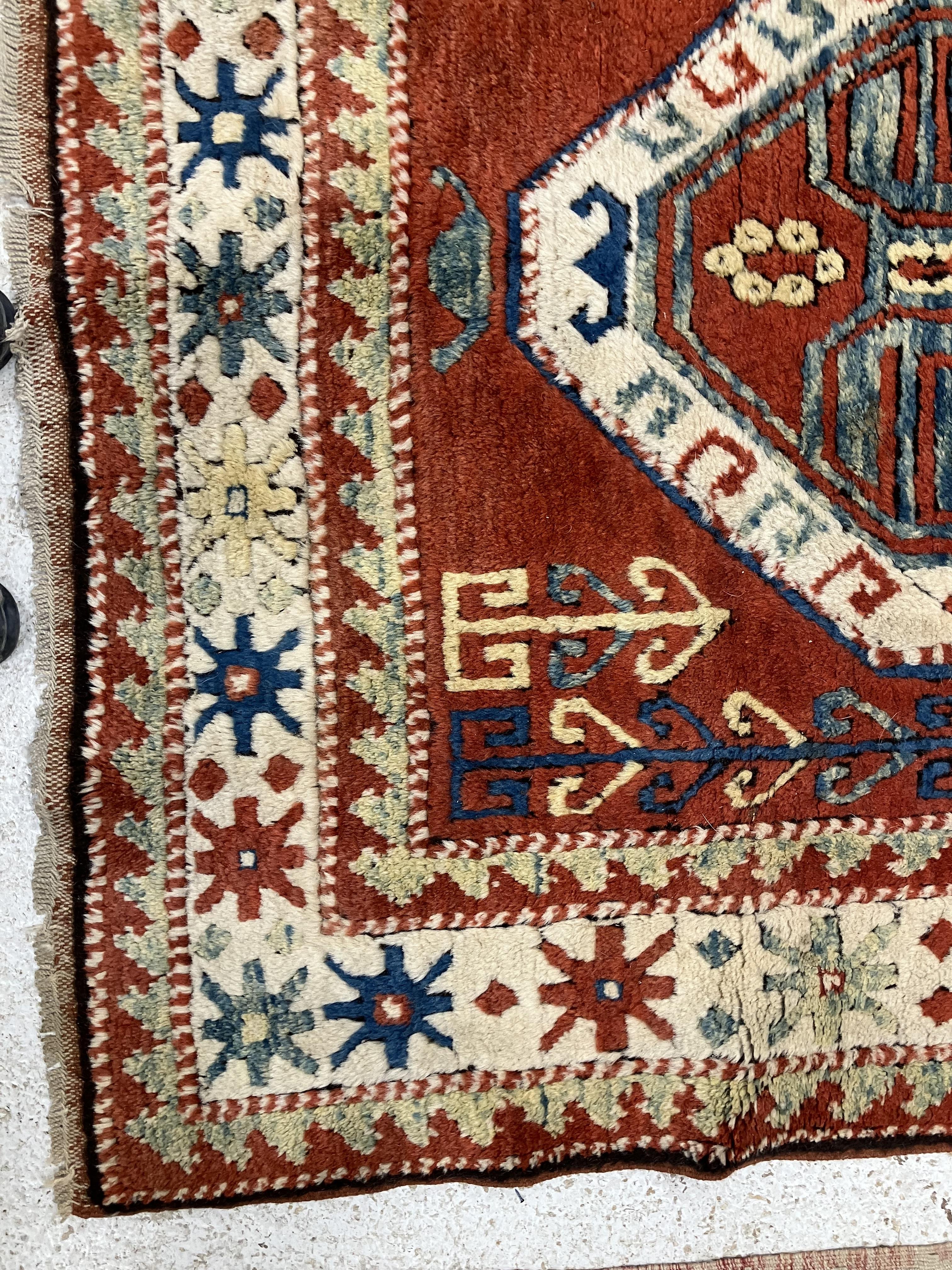 A fine Turkish carpet, - Image 12 of 16