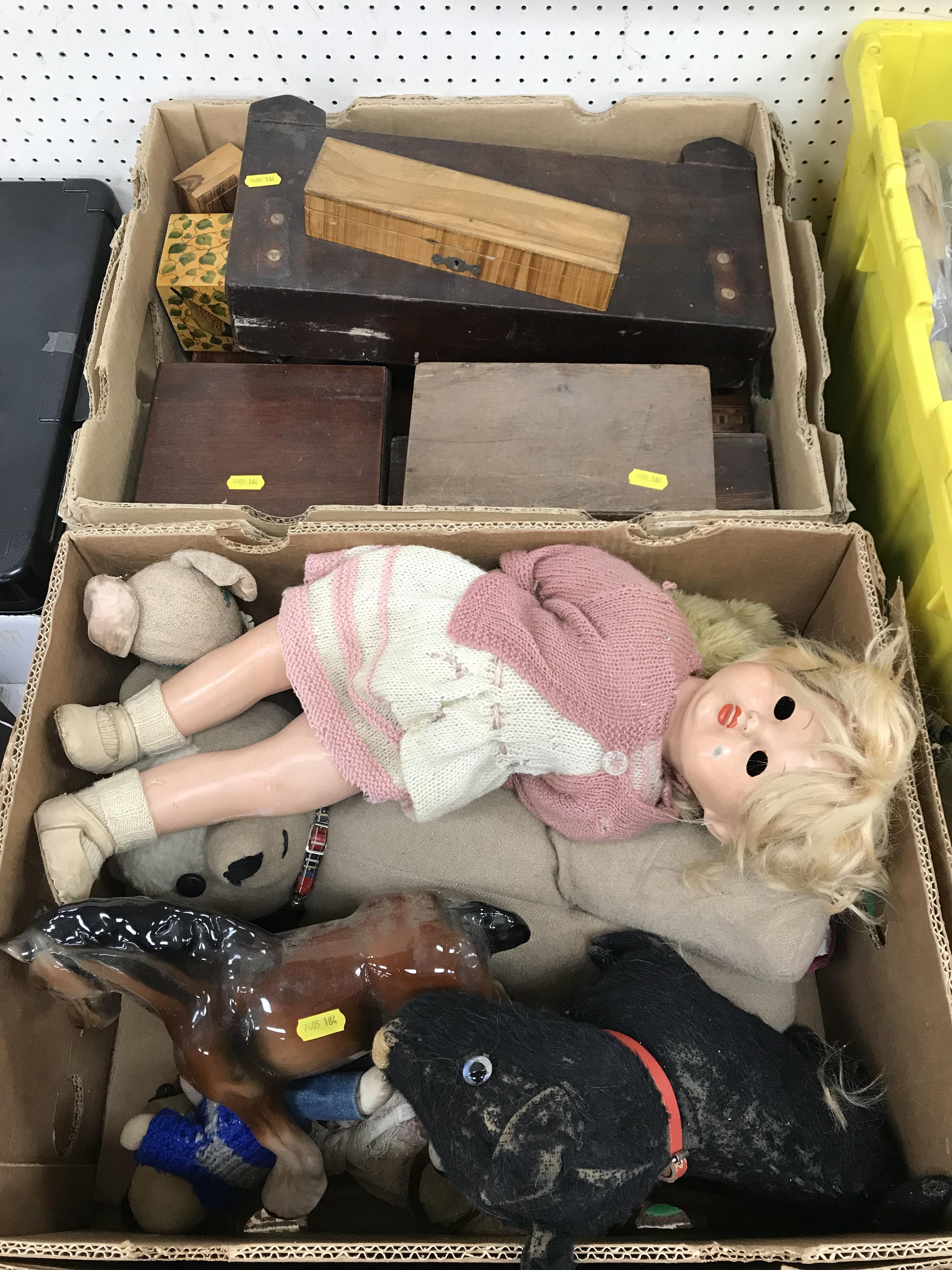 A box of various soft toys,