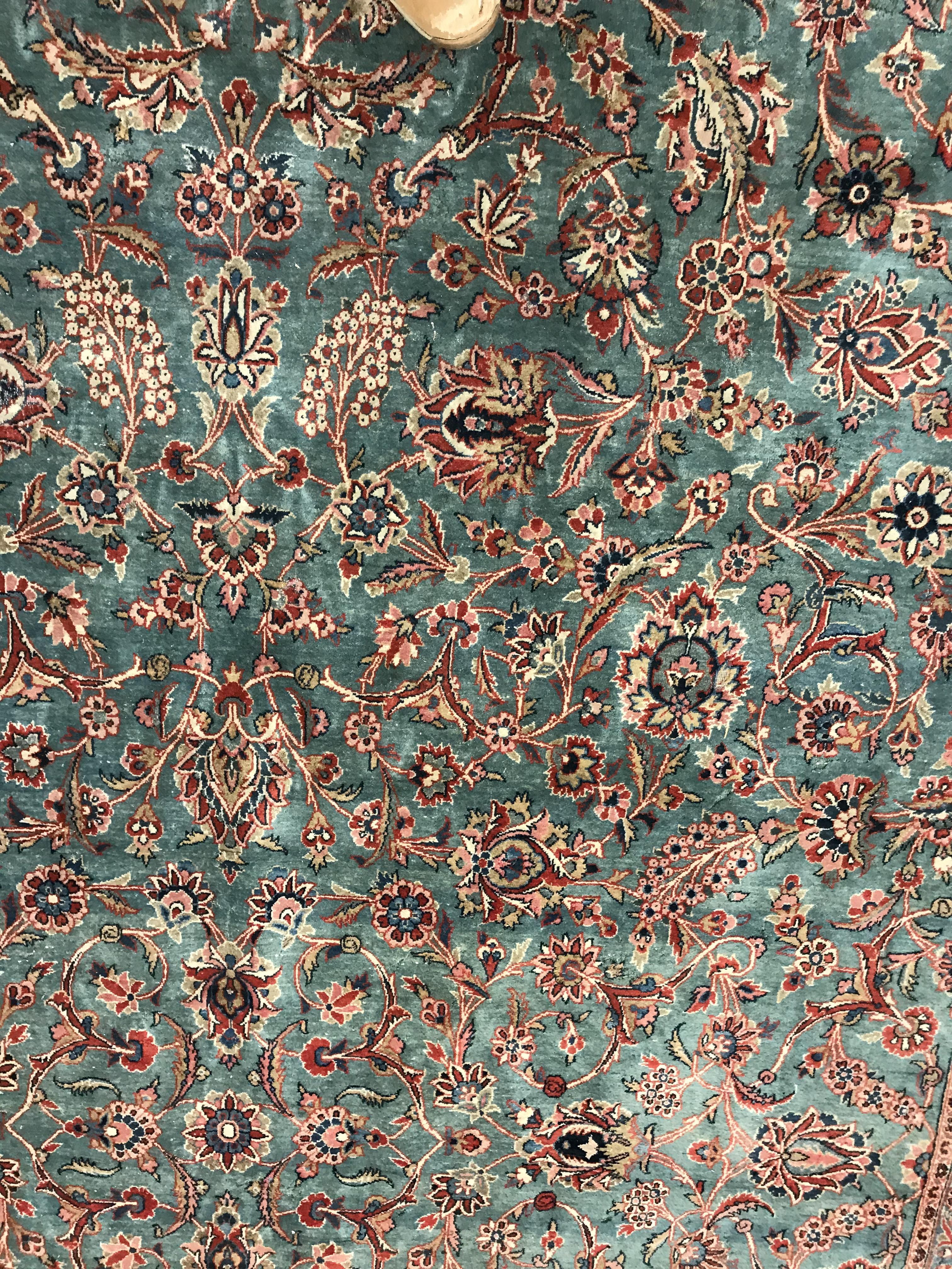 A Persian carpet, the central panel set with all-over scrolling foliate design on a teal ground, - Image 8 of 41