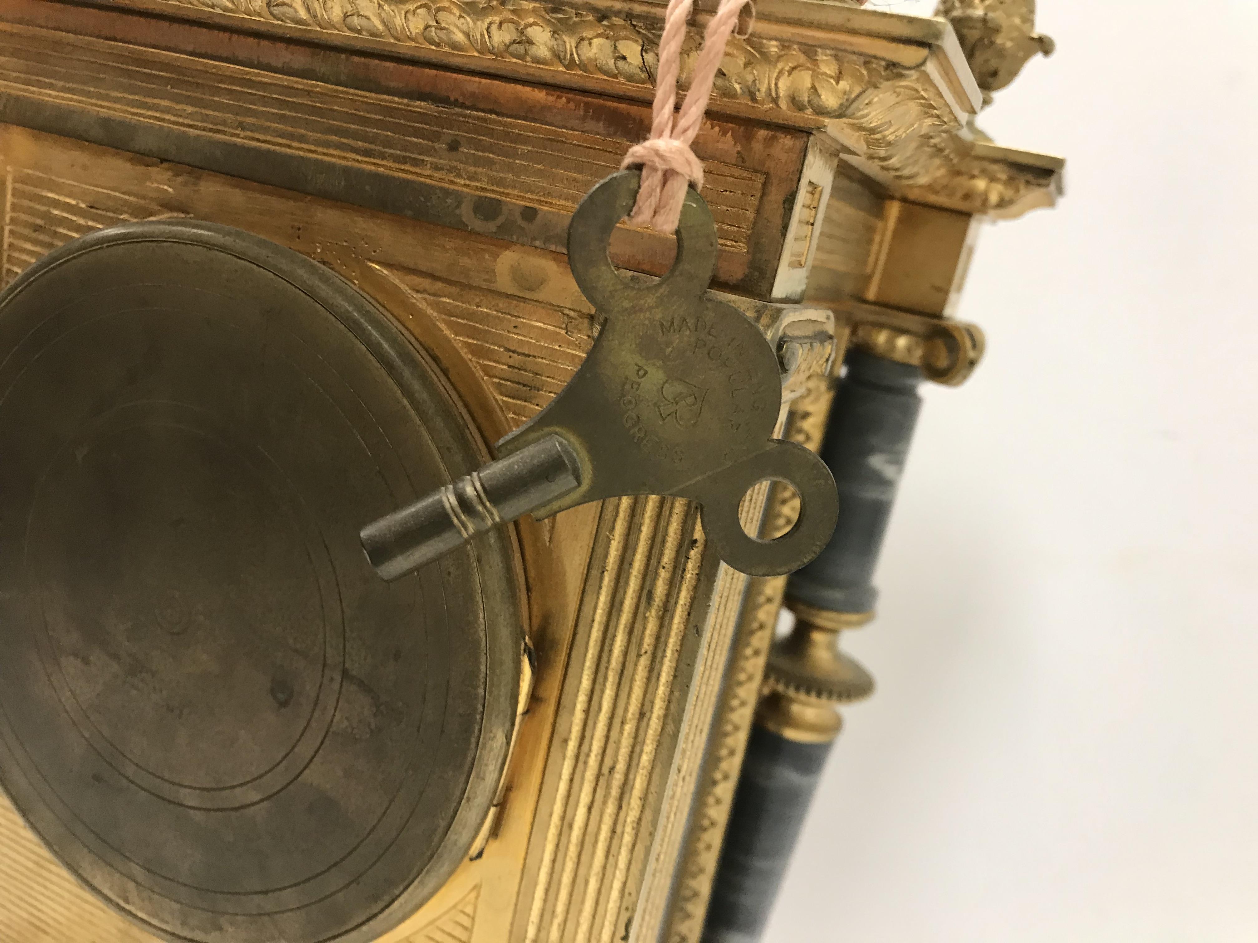 A circa 1900 brass and grey marble cased clock garniture, - Image 4 of 4