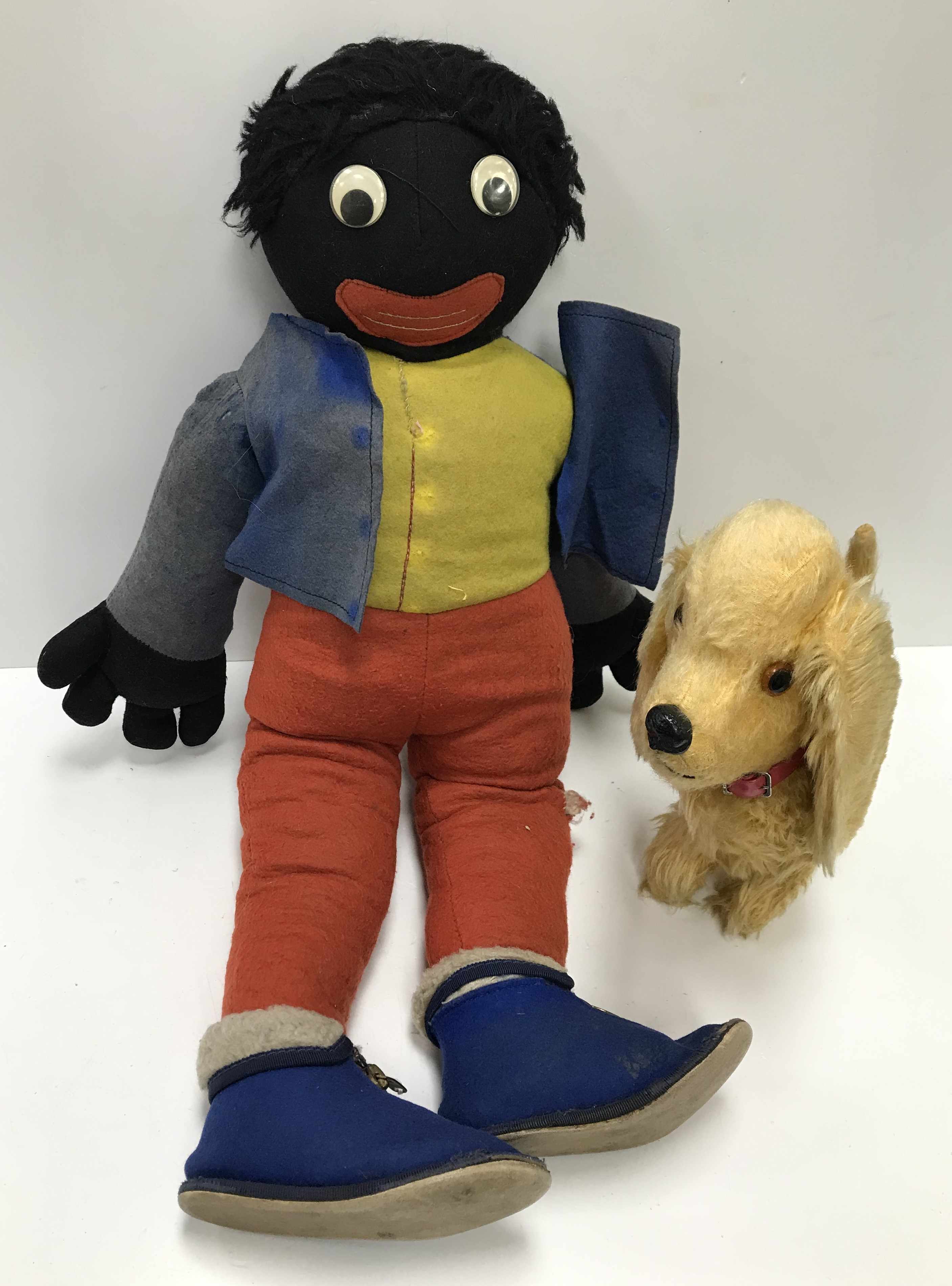 A felt covered soft "Golly" toy, 57 cm high and a Pedigree gold plush dog figure,