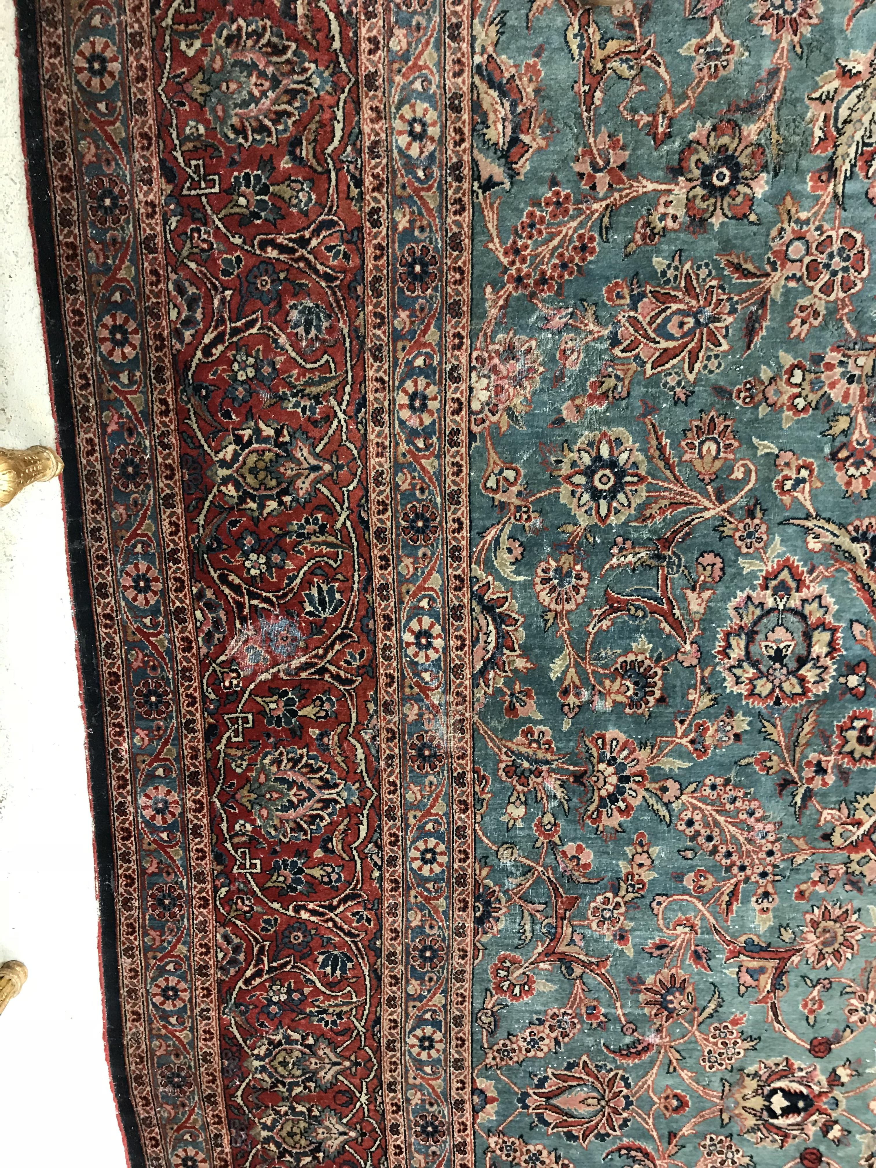 A Persian carpet, the central panel set with all-over scrolling foliate design on a teal ground, - Image 6 of 41