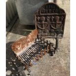 A wrought iron fire basket with dogs,