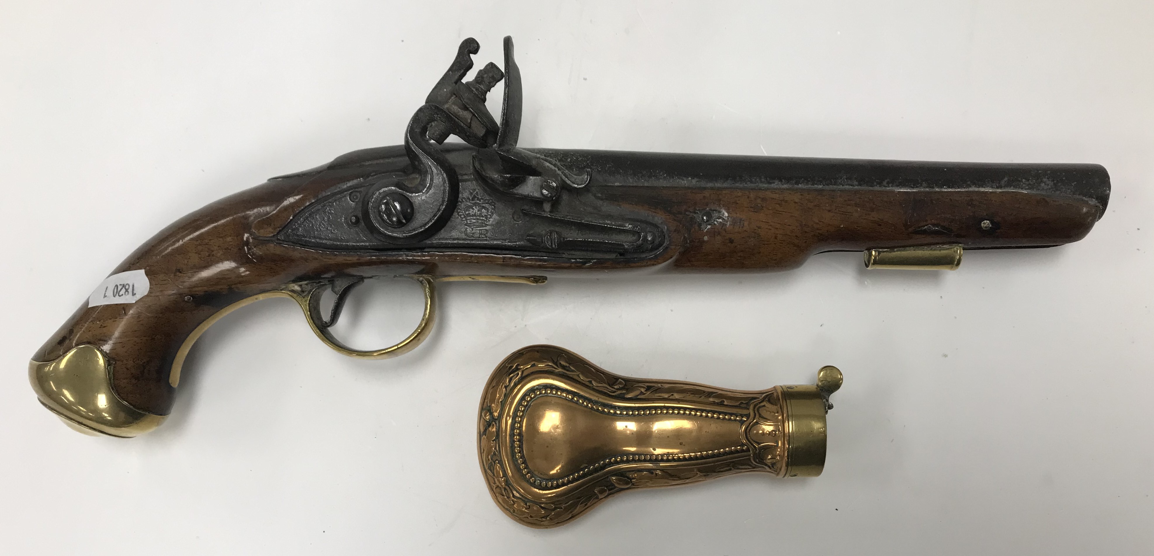 A George III flintlock pistol with straight grained walnut woodwork,