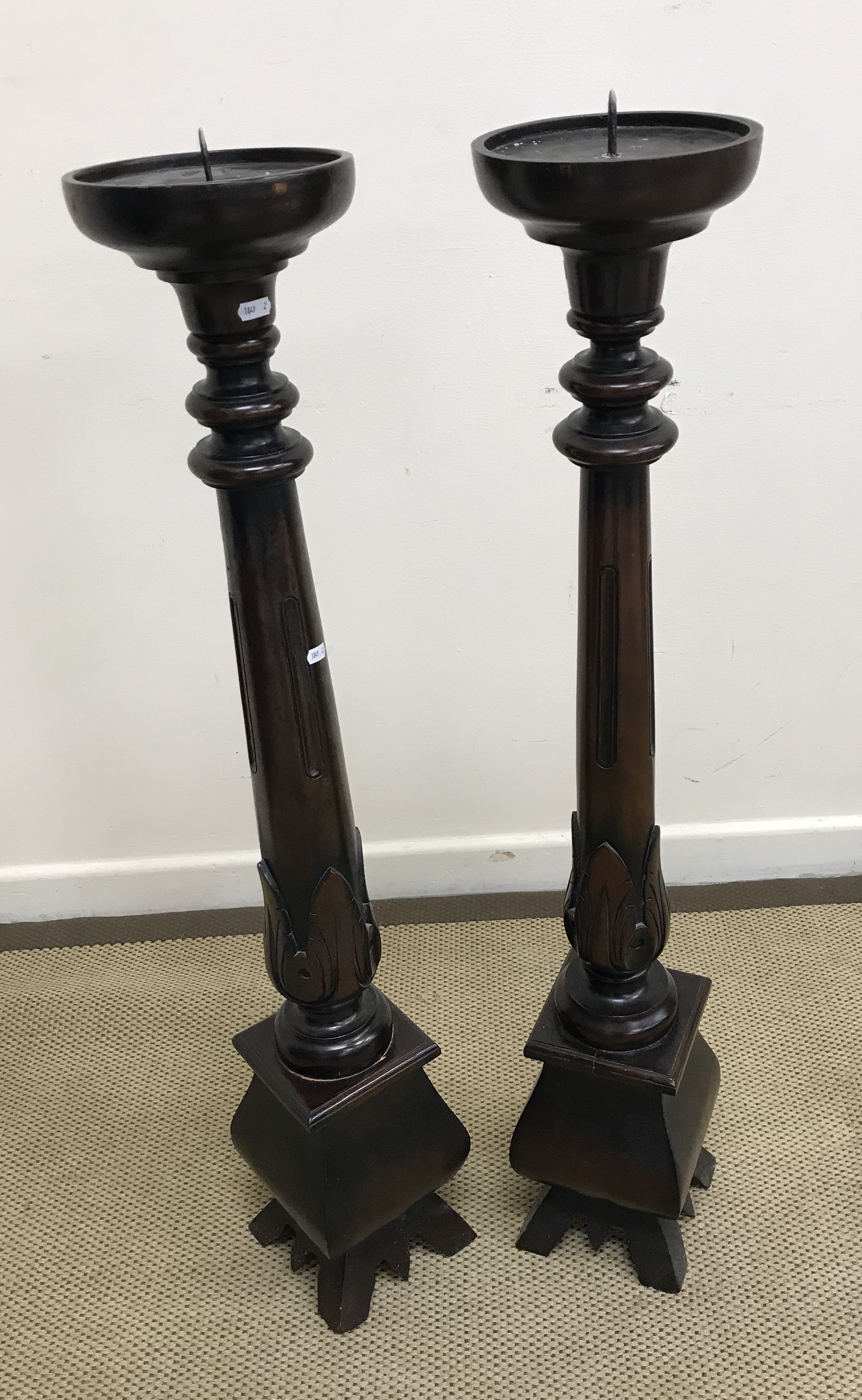 A pair of modern mahogany torchère stands, or pricket candlesticks,