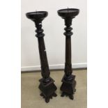 A pair of modern mahogany torchère stands, or pricket candlesticks,